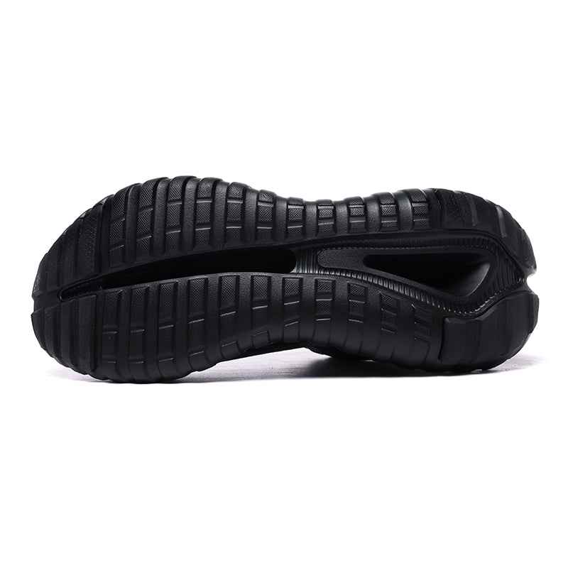Black rubber sole of Swag Chic sneakers showing tread pattern and flex groove for traction