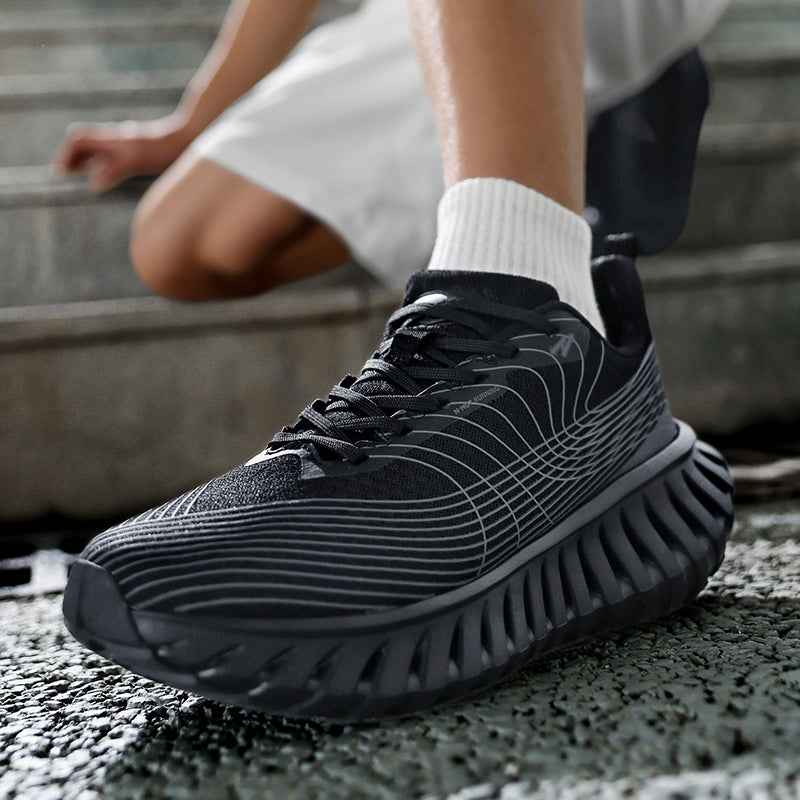 Swag Chic black sneakers with white striped design and thick cushioned sole being worn with white socks