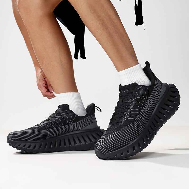 Swag Chic black sneakers with unique thick ridged sole and white striped design on feet