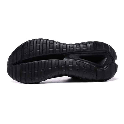 Black rubber sole of Swag Chic sneakers showing tread pattern and flex groove for traction