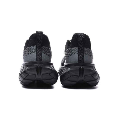 Rear view of black and gray sneakers with textured soles by Swag Chic