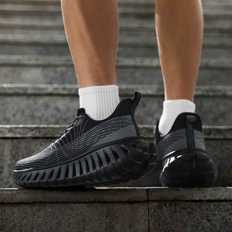 Swag Chic black and gray sneakers with thick sole worn on stairs with white socks