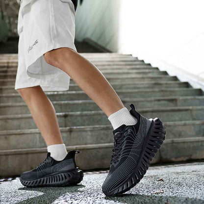 Swag+Chic black sneakers worn with white crew socks and white shorts on concrete stairs