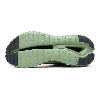Bottom view of green and black Swag Chic sneakers sole with detailed tread pattern