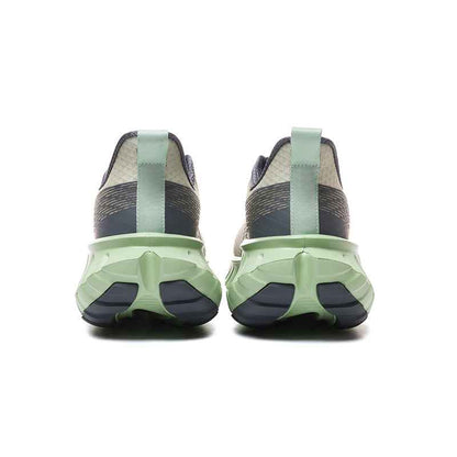 Rear view of Swag Chic sneakers with green and black sole and fabric upper